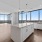Open Concept Kitchen and Living Room with Floor to Ceiling Windows